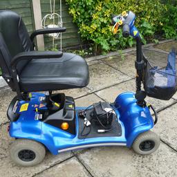 A Sterling foldable mobility Scooter in good clean full working order, Metallic Blue paintwork, adjustable seat, small shopping basket to front, battery charger, good tyres, can be seen working, any trial welcome.