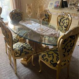 Absolutely stunning showpiece dining table and 6 chairs. Imported from Spain and only used for show. Change of decor force's sale. Collection from Sunderland