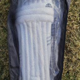 Adidas junior rookie cricket pads. New and carried in a mesh case.