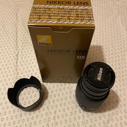 Nikon lens in excellent condition hardly used comes with glare protector both covers and box