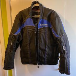 A black with blue colours strips in it motorbike jacket very good condition with removable lining and padded in the right places a bargain