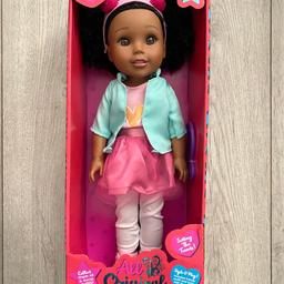 New 
Collectible 15” Beautiful doll named Tatiana, with black curly hair and pink headband. Changeable clothing. 4 dolls to collect. Comes with comb. Like the our generation dolls. Age 3+