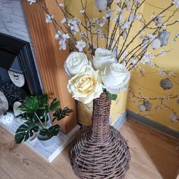 yellow and white fake flowers wiv wicker vase in good condition collection only thank u
