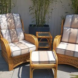 used wicker set with newly upholstered cushions.
two chairs,
one table,
one footstool.