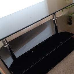 Black used TV stand in very good condition,up to 55 inches,few small scratches,pick up or local delivery only.