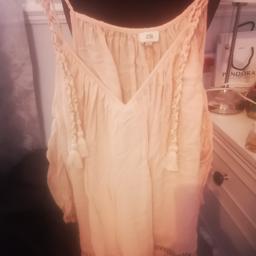 River island lovely strappy top... Peachy colour. Wired round top 