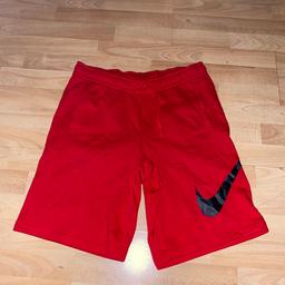 Men’s red Nike shorts size M