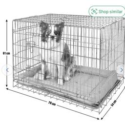 Hardly used Keep your pet safe and secure with this resilient metal dog cage. Suitable for indoor use to keep your pets secure and also convenient for travelling with your pet. Easy to set up and fold down for storage, this cage collapses in a folding suitcase style with carry handle for easy transport. Removable wipe clean plastic tray. Mattress not included. Double door with two locks allows for ease getting your dog in and out as wellas keeping them secure. Medium size suitable for breeds i