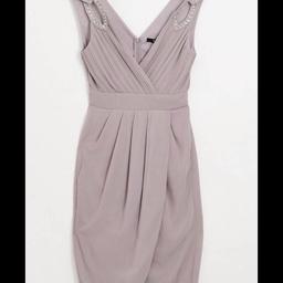 TFNC bridesmaid exclusive wrap midi dress with embellished shoulder in grey/mauve. I have a size 12. Body: 100% Polyester, Lining: 100% Polyester
New with tags