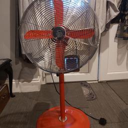 Red retro style floor standing fan.  Works perfectly.  Good condition