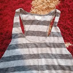 grey racer back vest top. in excellent condition. size 10