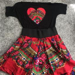 Beautiful folk set skirt and top (skirt with tutu) used just once. Fits size 12-14 Pet and smoke free house