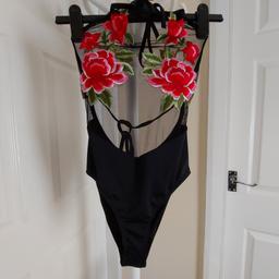 Swimsuit”Pretty Little Thing” Black Colour New With Tags

Actual size: cm

Height: 63 cm from neck

Volume bust: 60 cm – 70 cm

Volume Waist: 55 cm – 65 cm

Volume hips: 60 cm – 70 cm

Size: 8 (UK)

Main: 95 % Polyester
 5 % Elastane

Panel: 84 % Polyamide
 16 % Elastane

Lining: 100 % Polyester

Applique: 100 % Polyester

Made in China

Price £ 20.90