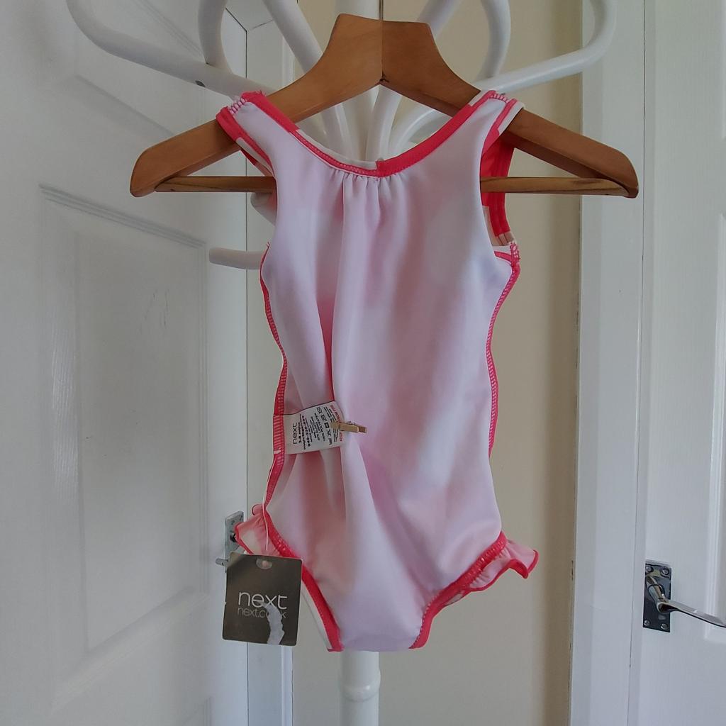Swimwear "Next"
Pink Mix Colour
New With Tags

Actual size: cm

Length: 38 cm from shoulders

Length: 19 cm from armpit side

Shoulder width: 15 cm

Volume hands: 20 cm

Volume breast: 40 cm - 50 cm

Volume waist: 35 cm – 40 cm

Volume hips: 40 cm – 45 cm

Age: 3-6 Month,up to 18 lbs (UK) Eur 8 kg

Main: 80 % Nylon
 20 % Elastane

Lining: 100 % Polyester

Made in China