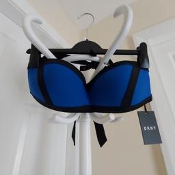 Swimwear Bra"DKNY"
Dark Blue Black Colour
New With Tags

4-Way Stretch

UV Protection UP To 50 + UPF/SPF

Actual size: cm

Breast volume: 80 cm – 85 cm

Depth bust: 15 cm

Size: M (UK) Eur M,US M

Shell: 84 % Nylon
 16 % Spandex

Lining: 92 % Polyester
 8 % Spandex

Made in China