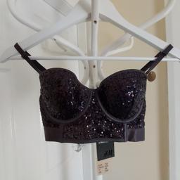 Bra "H&M" Balconette Bustier Dark Grey Colour
With Purple Sparkle
 New With Tags

Available in D- Cup Underwire Bra

Actual size: cm

Length: 25 cm from shoulders

Shoulder width: 26 cm

Hand volume: 25 cm – 30 cm

Volume Bra: 60 cm - 70 cm

Depth: 12 cm

Size: 34B (UK) Eur 75B,
US 34B,FR/ES 90B

Front Net: 100 % Polyamide

Wing Net: 82 % Polyamide
 18 % Elastane

Lining: 100 % Polyamide

Cup Lining: 100 % Polyester

Made in China