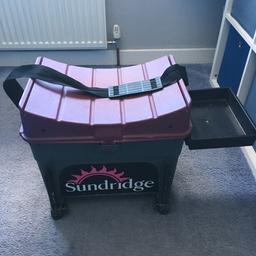 Sundridge fishing seat box has ajustable legs comes with side tray and a strap for transport and plenty room for storage in Top condition