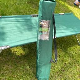 Green Fabric Camp bed
Metal legs
Folds into storage bag
Very easy to assemble.

No rips or tears in camp bed. Been stored indoors

Bag also no rips or holes on this one.