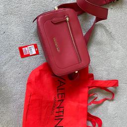Like new used once dark red with dust bag bag is called Rosso
