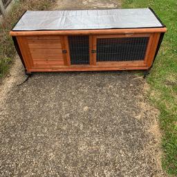 Rabbit/Guinea pig Hutch which comes with insulation cover.
The locks are a bit stiff but open and close perfectly well