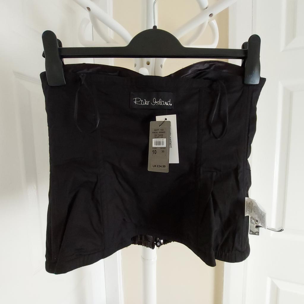 Corset„River Island“Strapless Black Colour New With Tags

Corset has the "sticks":Sticks from the top down 6 units.

Actual size: cm

Length: 34 cm from breast

Length: 31 cm from armpit side

 Volume chest: 75 cm - 80 cm

Chest depth: 12.5 cm

Volume waist: 68 cm – 70 cm

Volume hips: 73 cm – 75 cm

Size: 10 (UK) Eur 36

98 % Polyester,2 % Elastane.

Contrast: 82 % Nylon
 18 % Elastane

Front: 100 % Polyester.

Lining: 97 % Cotton
 3 % Elastane

Made in Bulgaria

 Retail Price £ 34.99