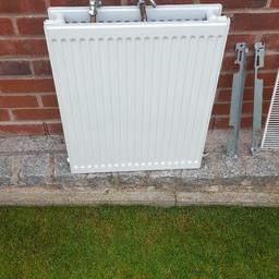 Double radiator with thermostatic  and drain of valves like new . measuring 500mm w x 600mm h x 100mm d. £12 pick up only