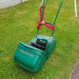 full working order classic Qualcast rotary mower with grass collecting bucket.
height adjustable metal cutting blades.
built in lawn roller which creates a striped lawn effect.
collection only.