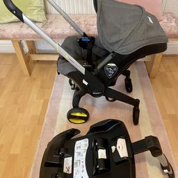 Doona car seat / stroller and isoFix base. Plus new baby inserts. Good condition. Colour storm grey.