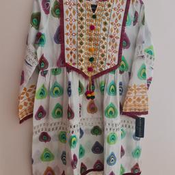 lawn suit with laces
and embroidri
with tulip