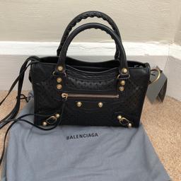 Brand new Balenciaga mini city bag. RRP £1350
Black perforated leather city bag in black with brass hardware so will go will all outfits. Comes with strap. Never been used