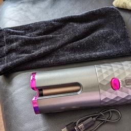 automatic hair curler left/ right settings 
temperature settings 
in bag with charger
like new