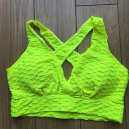 Ladies yellow sports bra Size large . New never been used. Please see my other items for sale