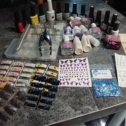 some new some used
*14 gel nail polishes ( most of them haven't used at all ) 
* 3 boxes odd tips
*70 pieces of coloured tips different designs
*2 rolls of nail fold
*4 sheets of different nail stickers
* Glitter
*New nail clippers
* Shine file
*3 full bottles kiss brush cleaner
*Half bottle of gel activator
*3 bottles of acrilic liquid 
* 2 acrylic powder
*1 nail glue
*Little bit slip solution