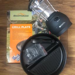 Brand new griddle plate, frying pan with handle and attachment never used. Working wind mountain warehouse might with different light settings
