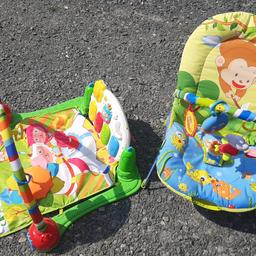 bouncey chair with toys and vibration/music box - slight damage to one clasp, but still fastens.
play mat with overhead toys and foot piano.