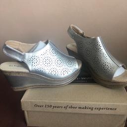 Silver sling back wedge sandal..made by cushion walk.like walking on air..Velcro strap for extra comfort.brand new in box.size 7.