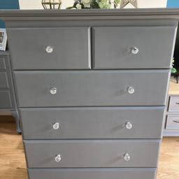 A lovely large chest of drawers with crystal glass knobs.
6 deep drawers in total, all made from solid wood. Extremely heavy so will need two people to move. 
Dovetail joints
Colour:meridian grey 

Can deliver locally 

Height 123cm
Width 88cm
Deoth 40cm