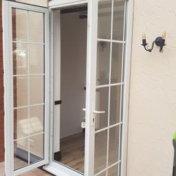 white upvc double doors in very good condition size 1400x2350.