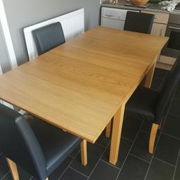Ikea extendable table with four black faux leather chairs good condition, needs to go for new kitchen, could possibly deliver locally for small fee.