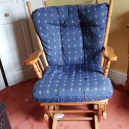 Rocking chair lovely soft cushions with light wooden arm rests good condition but has a little creak