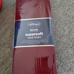 Brand new deep red fitted sheet