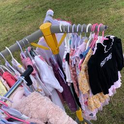 Vests, baby grows, hats, shoes, loads of outfits, tops, dresses, jeans, joggers, cot sheets. Everything in excellent washed condition, an absolute bargain, sizes included in the bundle are tiny baby right up to 6-9. Sleeping bags also included