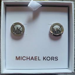Brand new in Michael Kors gift box silver tone MK logo stud earrings. Authentic Michael Kors. RPP £59. Collection available from Bristol.