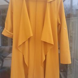 Mustard jacket would fit size 12/14. Sleeves can be worn long or buttoned up (see pics) Collect only.