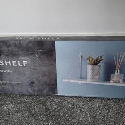Brand new 
White wooden shelf 
W 50 x D 14.5 X H 23 CM.
can post if postage costs are covered