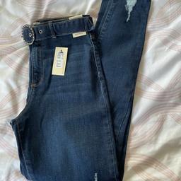 Age 12. Girls river island jeans brand new with tags. Rio detail with belt.