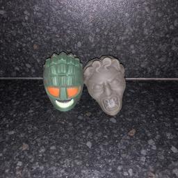 Doctor Who squeezy stress ball toys in the shape of the heads of an Ice Warrior and a Weeping Angel. In good condition