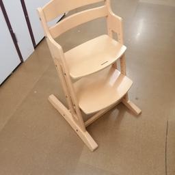 Solid wood sturdy high chair. No baby strap however can also be used for growing kids. Can take adult weight.