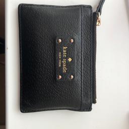 Genuine Kate spade card holder. Bought from USA. Black leather. Has three card slots and zip compartment. Has been used a lot but still in good condition.