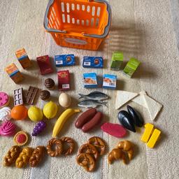 Sainsburys shopping basket and food cartons.
Fruits, bakery items, cakes meat etc